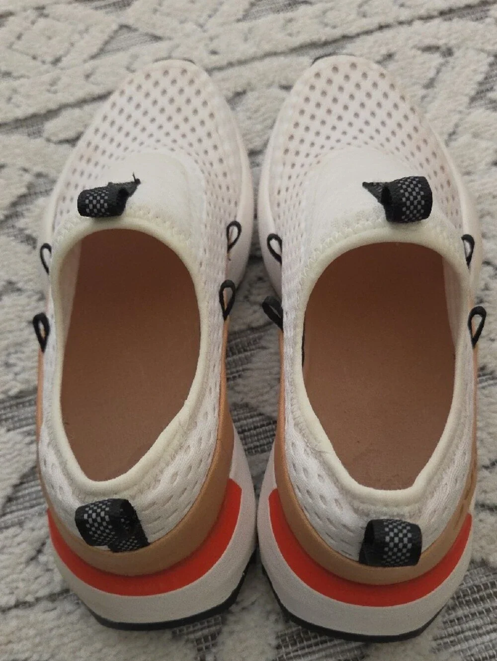 Sorel Slip-On Sneakers in White and Tan with Black Logo